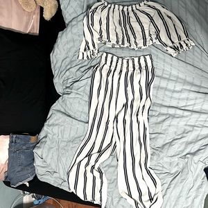 A romper with blue and white stripes perfect for a beach cover-up or a dinner.